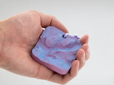 Real photo: Dawn keychain of Half Dome held in a hand