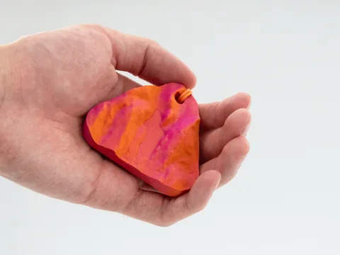 Real photo: a customer’s Ember keychain of The Bubble, Acadia held in a hand