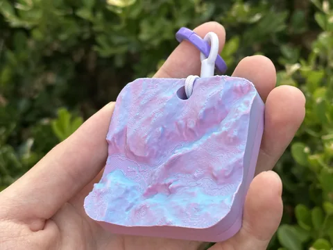 Real photo: Dawn keychain of Half Dome held in a hand