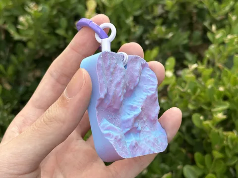 Real photo: Dawn keychain of Half Dome held in a hand
