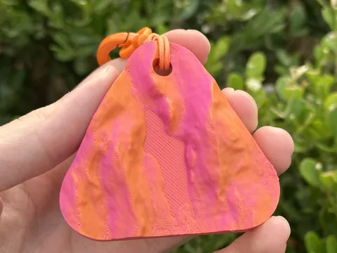 Real photo: a customer’s Ember keychain of The Bubble, Acadia held in a hand