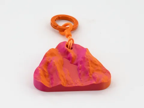 Real photo: a customer’s Ember keychain of The Bubble, Acadia, the same piece seen from four sides